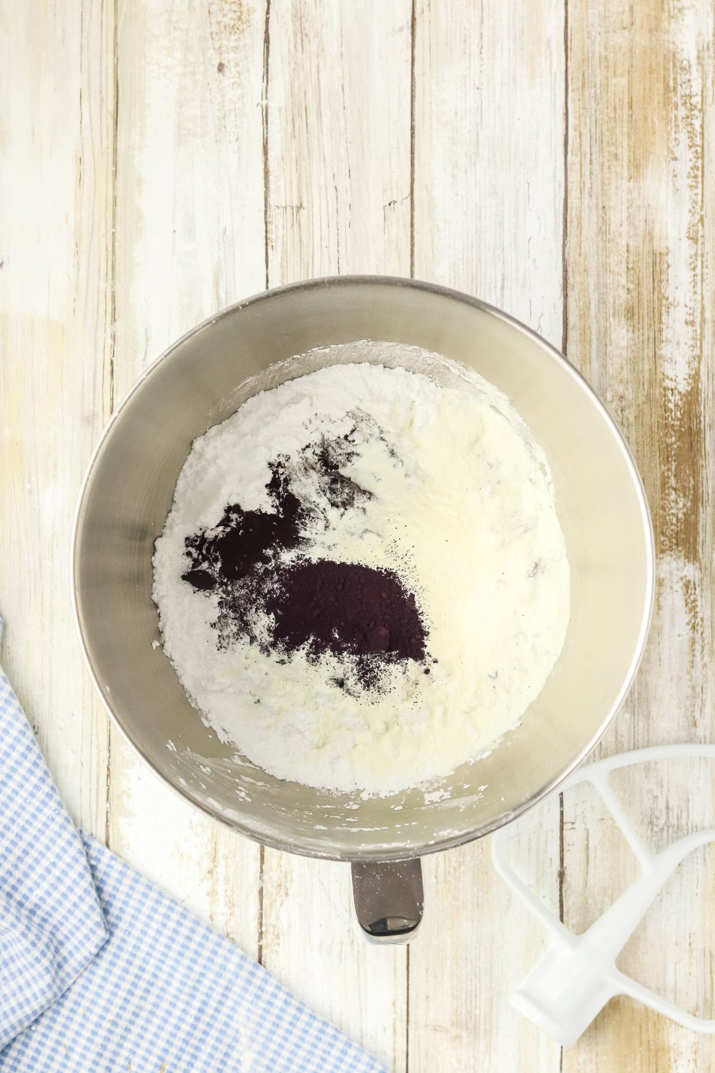 ingredients for black royal icing in a bowl