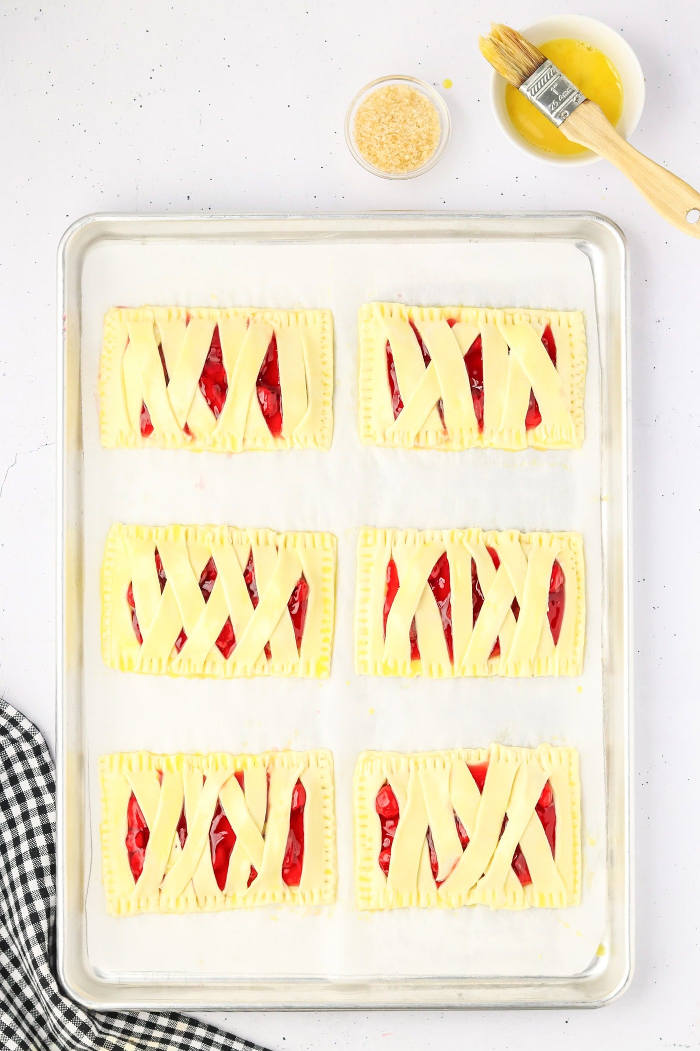 strips of puff pastry on top of rectangles with pie filling in between to make mummy puff pastries