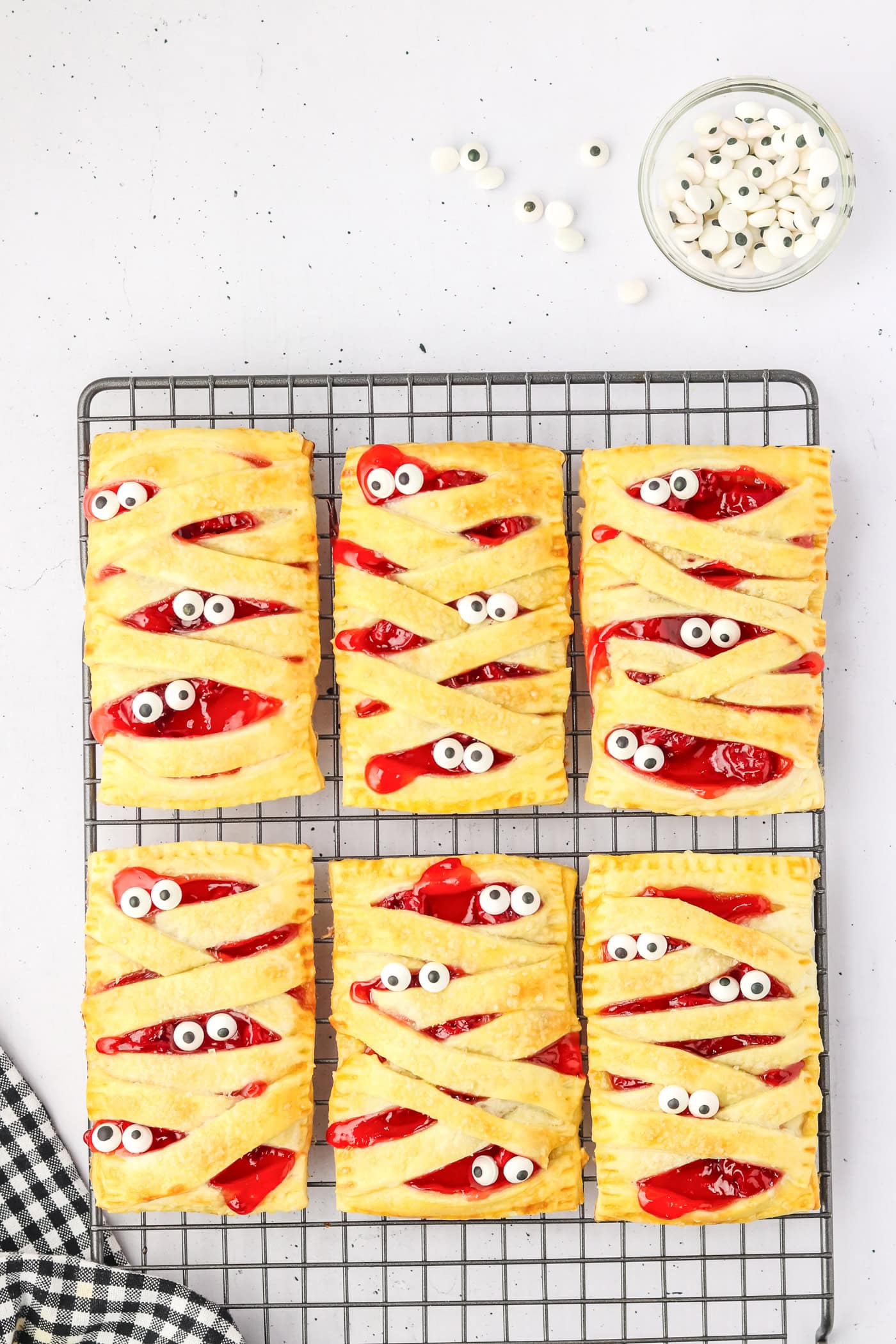 baked mummy pastries after adding the candy eyeballs