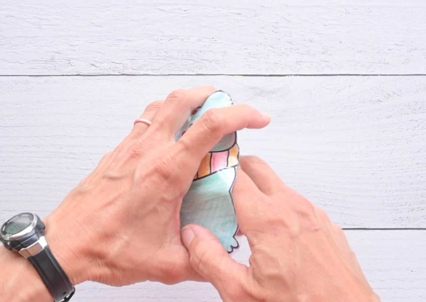 adding stuffing to a paper frog squishy