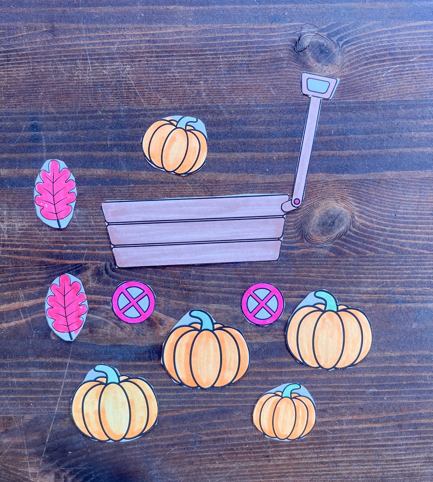a photo of a pumpkin wagon cut and paste craft colored and cut out